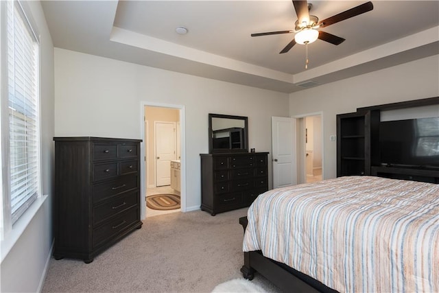 1076 Allspice Way, Lawrenceville, GA 30045 - bedroom with light carpet, a tray ceiling, ensuite bath, and ceiling fan