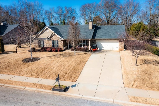 ranch-style house featuring concrete driveway, a garage, roof with shingles, and a chimney