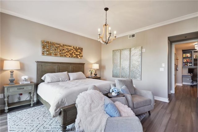 bedroom with ornamental molding, dark hardwood / wood-style floors, and a notable chandelier