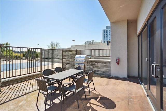 view of patio with area for grilling and an outdoor kitchen