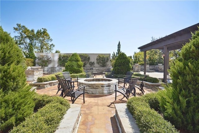 view of patio featuring an outdoor fire pit