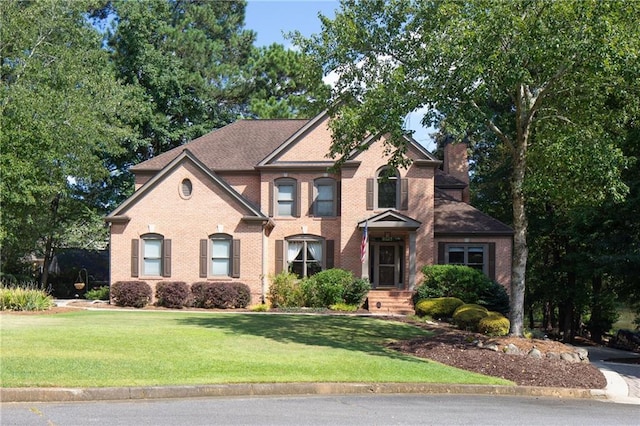 front facade with a front yard