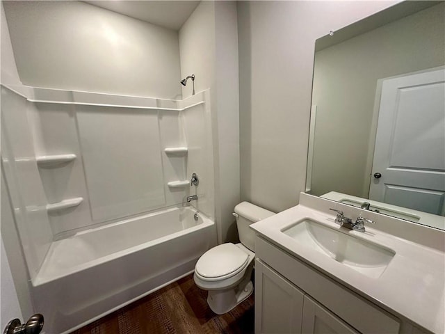 full bathroom with shower / tub combination, vanity, toilet, and wood finished floors