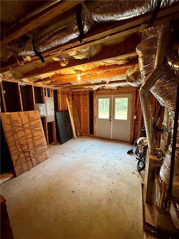 unfinished attic with electric panel