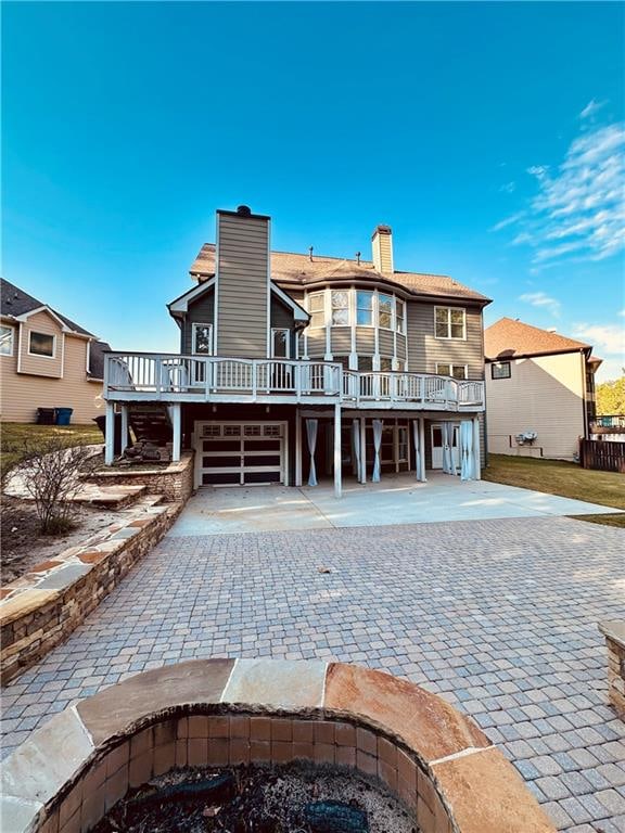 rear view of property with a deck