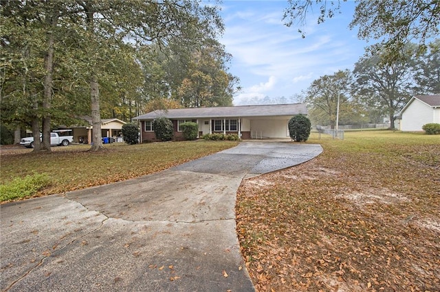 single story home featuring a front yard and a carport