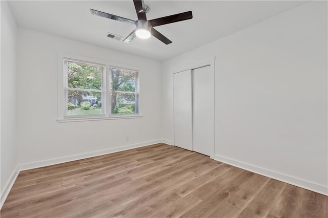 2060 Panstone Ct SW, Marietta, GA 30060 - unfurnished bedroom featuring light wood-style flooring, a closet, baseboards, and a ceiling fan