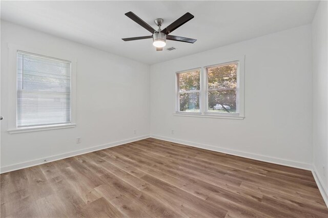 2060 Panstone Ct SW, Marietta, GA 30060 - empty room with wood finished floors, ceiling fan, and baseboards