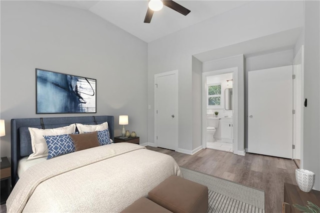 2060 Panstone Ct SW, Marietta, GA 30060 - bedroom with wood finished floors, vaulted ceiling, connected bathroom, baseboards, and a ceiling fan