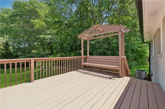 2060 Panstone Ct SW, Marietta, GA 30060 - wooden deck featuring central air condition unit, a pergola, and view of wooded area