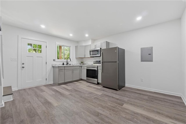 2060 Panstone Ct SW, Marietta, GA 30060 - kitchen featuring appliances with stainless steel finishes, gray cabinets, light wood finished floors, baseboards, and recessed lighting