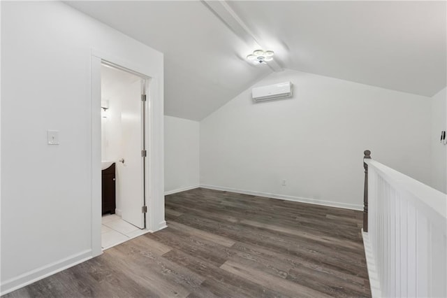 2060 Panstone Ct SW, Marietta, GA 30060 - bonus room with a wall unit AC, wood finished floors, lofted ceiling, and baseboards