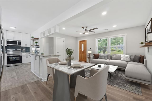 2060 Panstone Ct SW, Marietta, GA 30060 - dining area with light wood-type flooring, ceiling fan, and recessed lighting