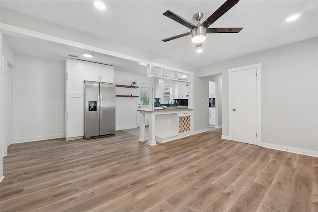 2060 Panstone Ct SW, Marietta, GA 30060 - unfurnished living room featuring a ceiling fan, light wood-style flooring, a sink, baseboards, and recessed lighting