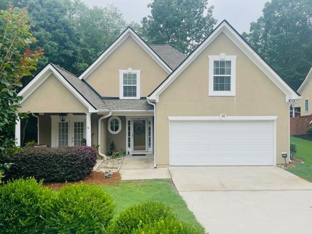 45 Fenway Ct, Newnan, GA 30265 - traditional-style home with an attached garage, stucco siding, and driveway