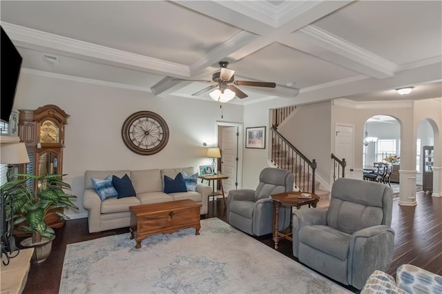 living room with ceiling fan, coffered ceiling, ornamental molding, dark hardwood / wood-style flooring, and beamed ceiling