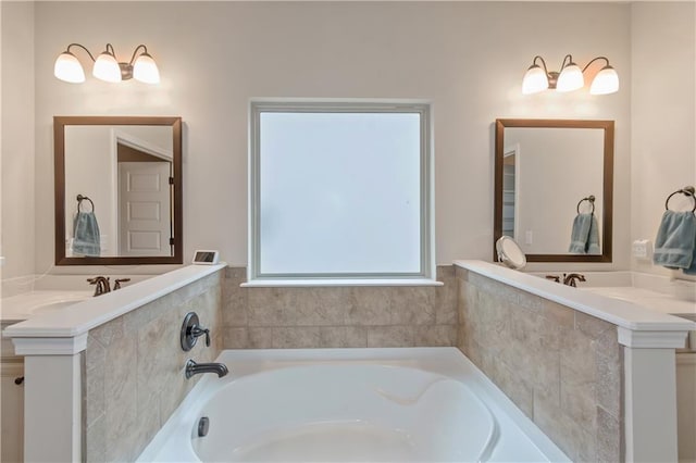 bathroom featuring a tub to relax in and sink