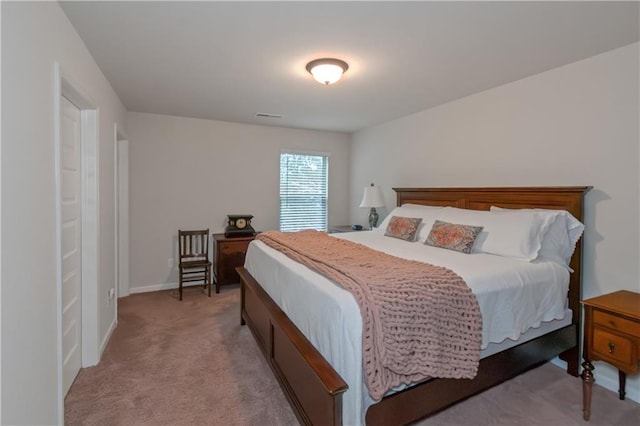 bedroom with light colored carpet