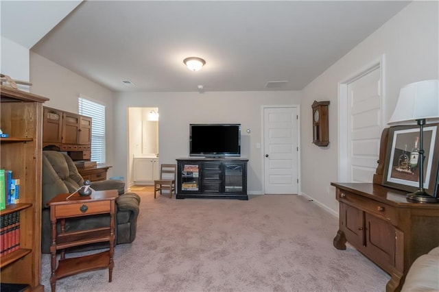 living room featuring light colored carpet