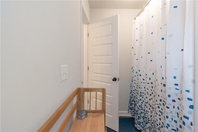 bathroom with a shower with curtain