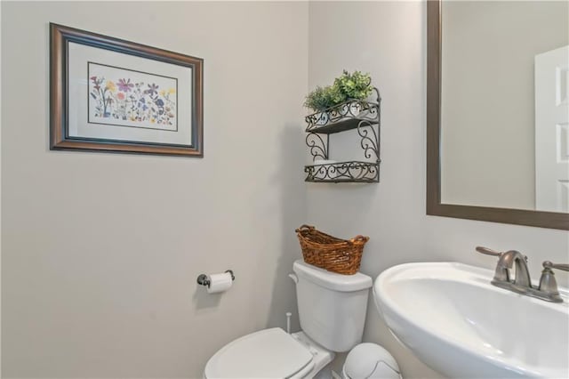 bathroom with sink and toilet