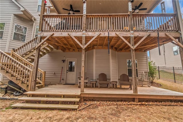 rear view of house with ceiling fan and a deck