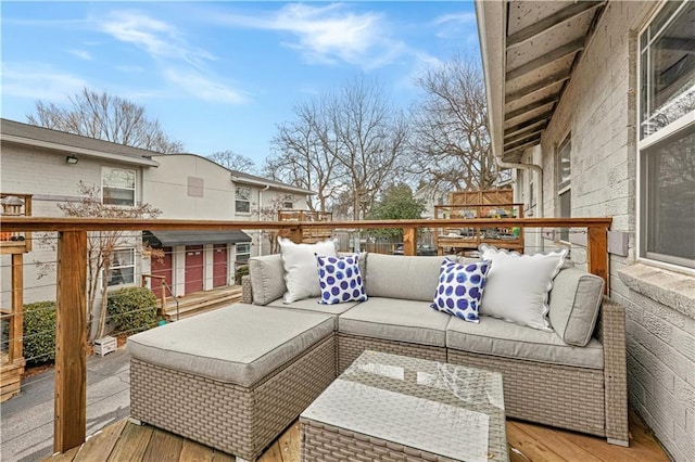 wooden terrace featuring an outdoor living space