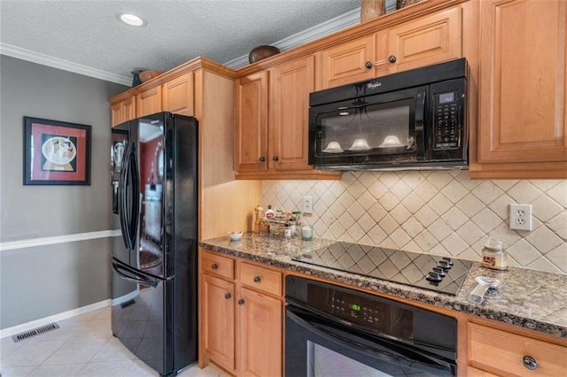 kitchen featuring tasteful backsplash, dark stone counters, light tile patterned floors, black appliances, and crown molding