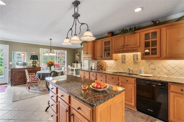 kitchen with dishwasher, plenty of natural light, sink, and pendant lighting