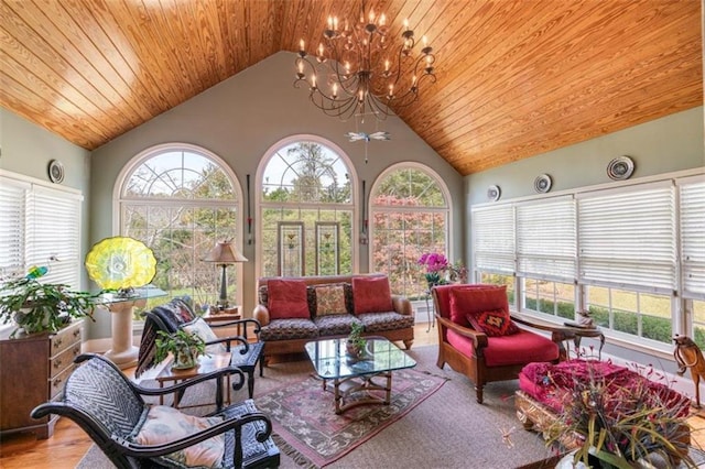 sunroom / solarium featuring lofted ceiling, a notable chandelier, and wood ceiling