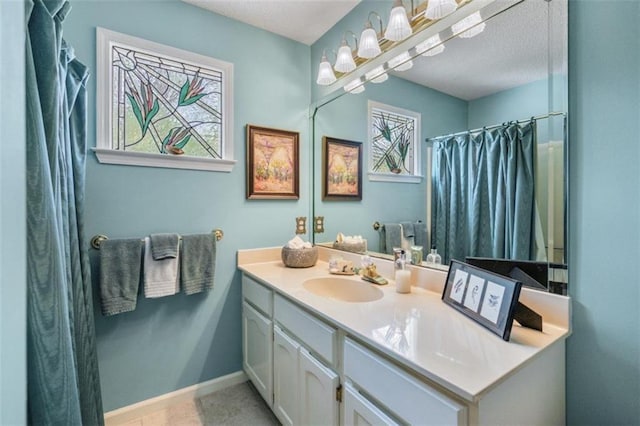 bathroom with vanity and a shower with shower curtain