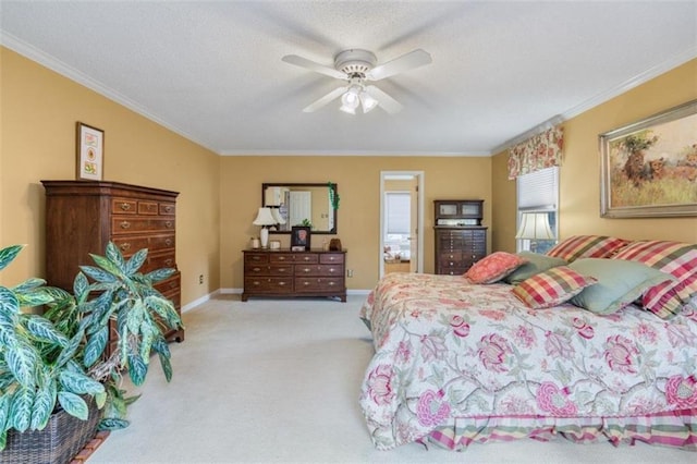 carpeted bedroom featuring ornamental molding and ceiling fan