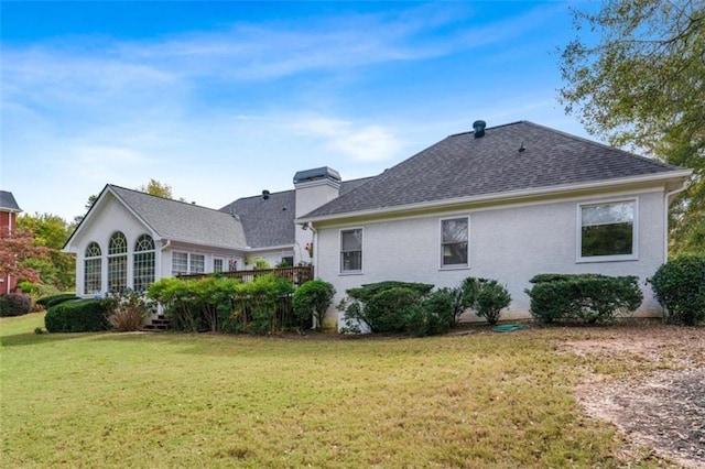 rear view of house with a lawn