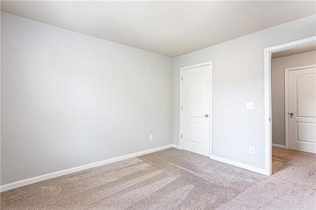 unfurnished bedroom featuring light colored carpet