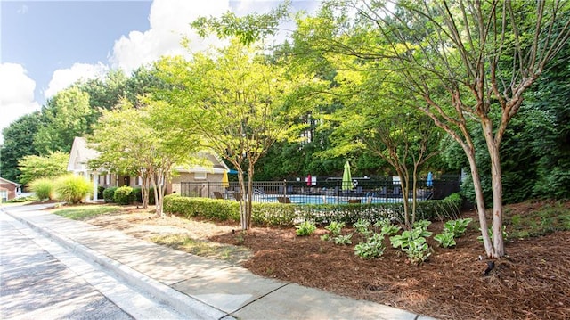 view of home's community with a swimming pool