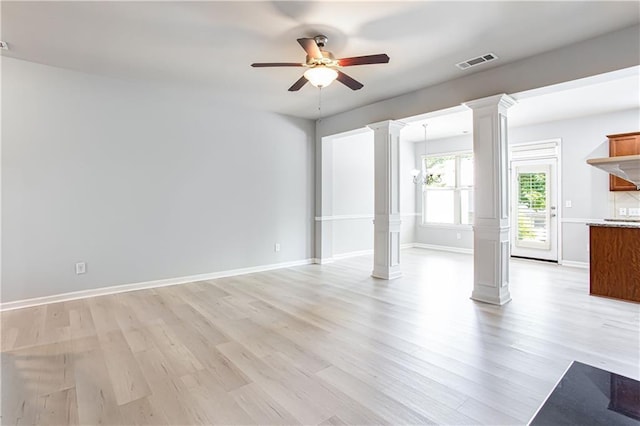 unfurnished living room featuring ornate columns, light hardwood / wood-style flooring, and ceiling fan