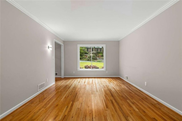 2892 Guinevere Dr NE, Atlanta, GA 30345 - unfurnished room featuring light wood-type flooring, baseboards, and crown molding