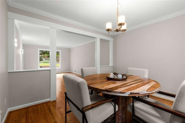 2892 Guinevere Dr NE, Atlanta, GA 30345 - dining area featuring crown molding, a chandelier, baseboards, and light wood-type flooring