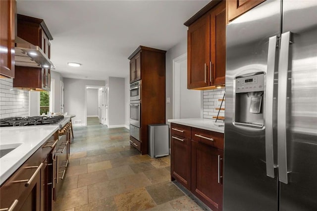 2892 Guinevere Dr NE, Atlanta, GA 30345 - kitchen featuring appliances with stainless steel finishes, backsplash, and light countertops