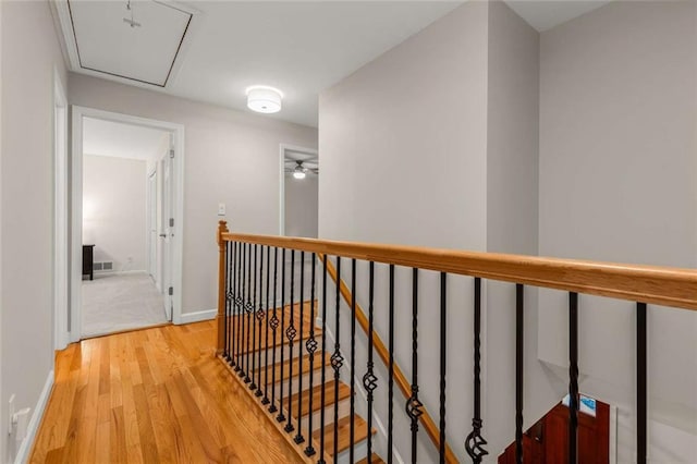 2892 Guinevere Dr NE, Atlanta, GA 30345 - hallway featuring wood finished floors, an upstairs landing, and baseboards