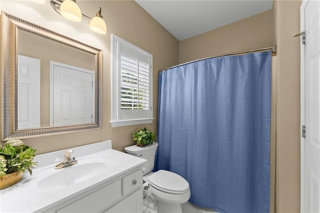 bathroom with curtained shower, vanity, and toilet