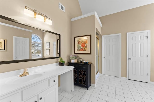 bathroom featuring vanity, tile patterned flooring, visible vents, and baseboards