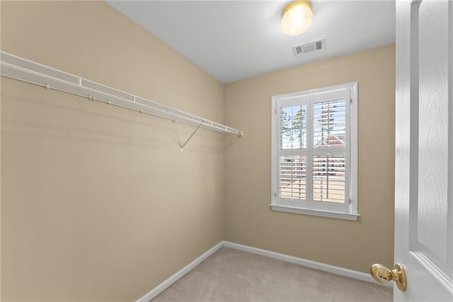 walk in closet featuring carpet floors and visible vents