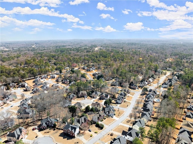 bird's eye view with a residential view and a wooded view