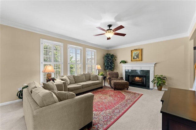 living room with baseboards, ornamental molding, a ceiling fan, and light colored carpet