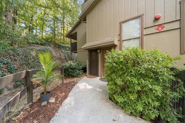 entrance to property featuring fence