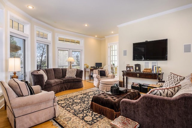 living room with crown molding, french doors, and light hardwood / wood-style flooring