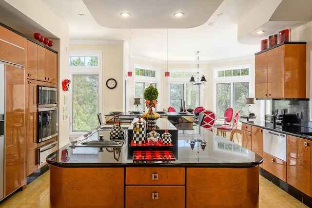 kitchen with a kitchen island, stainless steel appliances, light tile patterned floors, and tasteful backsplash