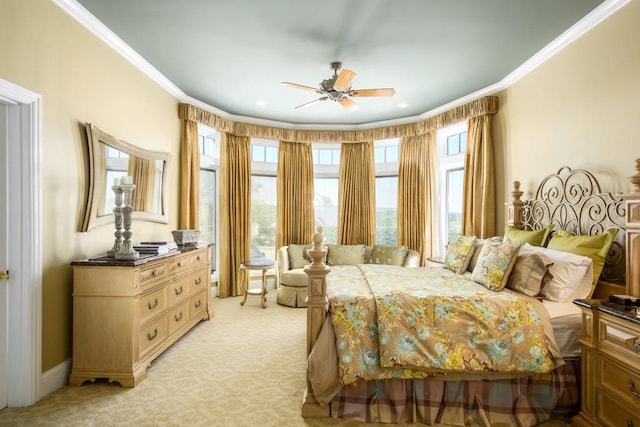 bedroom with crown molding, light colored carpet, and ceiling fan