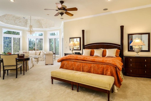 carpeted bedroom featuring ornamental molding and ceiling fan